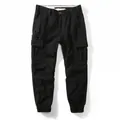 Professional studio shot of loose-fit black men's cargo jogger pants with utility pockets - 38 / Bottoms / Black