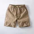 Vintage khaki cotton shorts for men featuring an elastic drawstring waist and side pockets - S / Bottoms / Dark Khaki