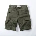Vintage olive green cotton cargo shorts for men featuring multiple utility pockets and buckles - 28 / Bottoms / Dark Army Green