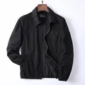 Classic American vintage men's black workwear jacket made of durable washed cotton fabric - S / Tops / Black