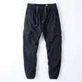 Classic men's navy blue vintage cargo jogger pants featuring an elastic drawstring waist - Crane Blue
