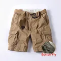 Men's khaki cargo shorts featuring a button fly and woven belt in a loose straight fit. - 28 / Bottoms / Dark Khaki