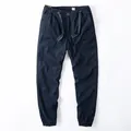 Dark navy blue men's joggers with elastic waist and drawstring detail - S / Bottoms / Sapphire Blue