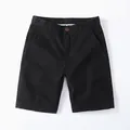 Casual black cotton shorts for men with vintage style featuring a button waist closure - 38 / Bottoms / Black