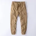 Men's khaki cotton cargo jogger pants with elastic drawstring waist and side flap pockets - Dark Khaki