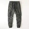 Vintage olive green men's cargo jogger pants with multi-pockets and drawstring tie - S / Bottoms / Army Green
