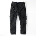 Vintage black men's cotton cargo pants featuring multiple functional pockets and straight leg fit - 38 / Black