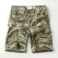 Men's cotton camouflage cargo shorts with multi-pocket design on white background - 38 / Bottoms / Forest Camo