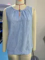 Detail view of light blue jacquard sleeveless top featuring a V-neck and metal buckle - S / Tops / Light Blue