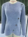 Detailed view of women's blue ribbed long sleeve knit top featuring a stylish tulip hem - S / Tops / Light Blue