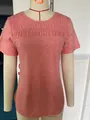 Detailed view of coral short sleeve T-shirt with elegant smocking and round neckline - Coral Pink