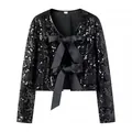 Detalle de chaqueta corta de lentejuelas negras con elegantes lazos de satén en la parte frontal - XS / Tops / Negro Nuevo