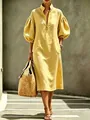 Detailed view of yellow linen-textured midi dress with puff sleeves and front zipper - S / Top And Bottom / Gold