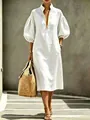 Close-up detail of white puff-sleeve midi dress with zipper neckline and high collar - S / Top And Bottom / White