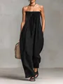 Detailed view of a black strapless jumpsuit featuring a smocked bodice and drawstring tie - S / Black