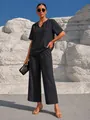 Completo casual nero con top a v e pantaloni larghi alla caviglia stile vacanza - Taglia S / Top E Pantaloni / Nero