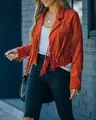 Detailed macro view of long tassels on a stylish orange faux suede jacket for women - S / Tops / Rust red
