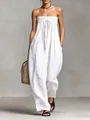 Dettaglio elegante della tuta bianca senza spalline con busto a punto smock e fiocco - Bianco