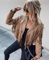 Close-up of a stylish brown suede fringe jacket worn by a model in an outdoor setting - S / Tops / Brown
