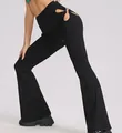 Detailed side view of black high-waisted ribbed flared pants with unique hip cutout - Black