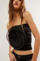 Detailed close-up of a chic black strapless tube top featuring a large 3D fabric flower decoration. - S / Tops / Black