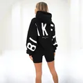 Back view of a black oversized thick hoodie with prominent white BLAKE print detail - S / Tops / Black