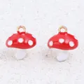 Detailed close-up of two red and white enamel mushroom charms featuring gold hanging loops - Large Mushroom / 1 Piece