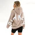 Detailed back view of a beige oversized hoodie with a white BLAKEY print. - Light Khaki with White Print