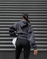 Detailed back view of a grey oversized women's hoodie with bold black 'MARLY' letter print. - Navy Blue