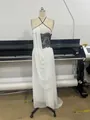 White halter maxi dress with black lace detail and flowing drapes on mannequin - XS / White Black