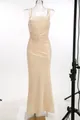 Champagne evening gown detail showing ruched pleated fabric and elegant mermaid fit. - XS / Dresses / Champagne Gold