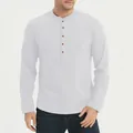 Close-up view of a classic white long-sleeved cotton Henley shirt featuring five brown buttons - S / Tops / White