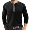 Close-up of black men's long-sleeved Henley shirt with grey contrast collar and stitching. - Black