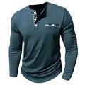Detail view of men's teal long-sleeved Henley shirt with contrast plaid placket details - Navy Blue