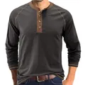 Detailed view of men's long-sleeve Henley shirt with contrast brown stitching - S / Tops / Dark Gray