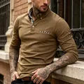 Slim fit brown long sleeve Polo shirt featuring checkered contrast details on collar. - S / Tops / Khaki