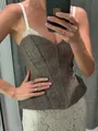 Close-up of women's fishbone corset top with delicate lace trim and thin straps - S / Tops / Khaki