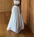 Elegant pure white two-piece fashion set featuring a bandeau crop top and voluminous maxi skirt - S / Top And Bottom / White