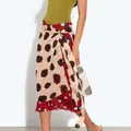 Detailed view of a contrasting polka dot wrap midi skirt featuring high waist tie closure - XS / Wrap Tie Polka Dot Skirt (As Pictured)