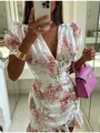 Selfie en el espejo de un vestido floral con cuello en V, mangas abullonadas y volantes - S / Top Y Pantalón / Rosa