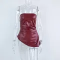 Detailed macro view of burgundy faux leather tube top on a clear plastic mannequin - S / Tops / Burgundy