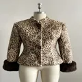 Front view detail of a leopard print faux fur jacket with stand collar and slim fit - S / Tops / Leopard Print