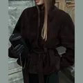Close-up of chocolate brown suede jacket featuring a belted waist and stand-up collar - S / Top (Belted Style) / Dark Brown
