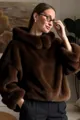 Detail shot of a plush brown faux mink fur hoodie showing thick and soft textured fabric - S / Tops / Dark Brown