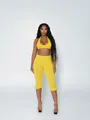 Detail view of yellow polka dot two-piece set with ruffled crop leggings - S / Top And Bottom / Yellow