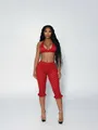 Model wearing a sexy red and white polka dot two-piece halter top and cropped pants set - S / Top And Bottom / Red