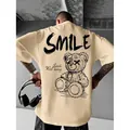 Heren casual beige katoenen T-shirt met korte mouwen en zwarte smile beer grafische print - Abrikoos