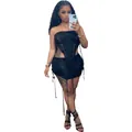 Detail of black knitted two-piece beach set featuring cutouts and fringe tassels - S / Top And Bottom / Black
