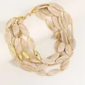 Detailed view of multi-layered beaded necklace with cream marbled oval stones and gold accents - Beige White Style (X-1322)