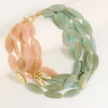 Detailed view of a multi-strand necklace with pink and green oval beads and gold accents - Pink And Green Style (X-1322)
